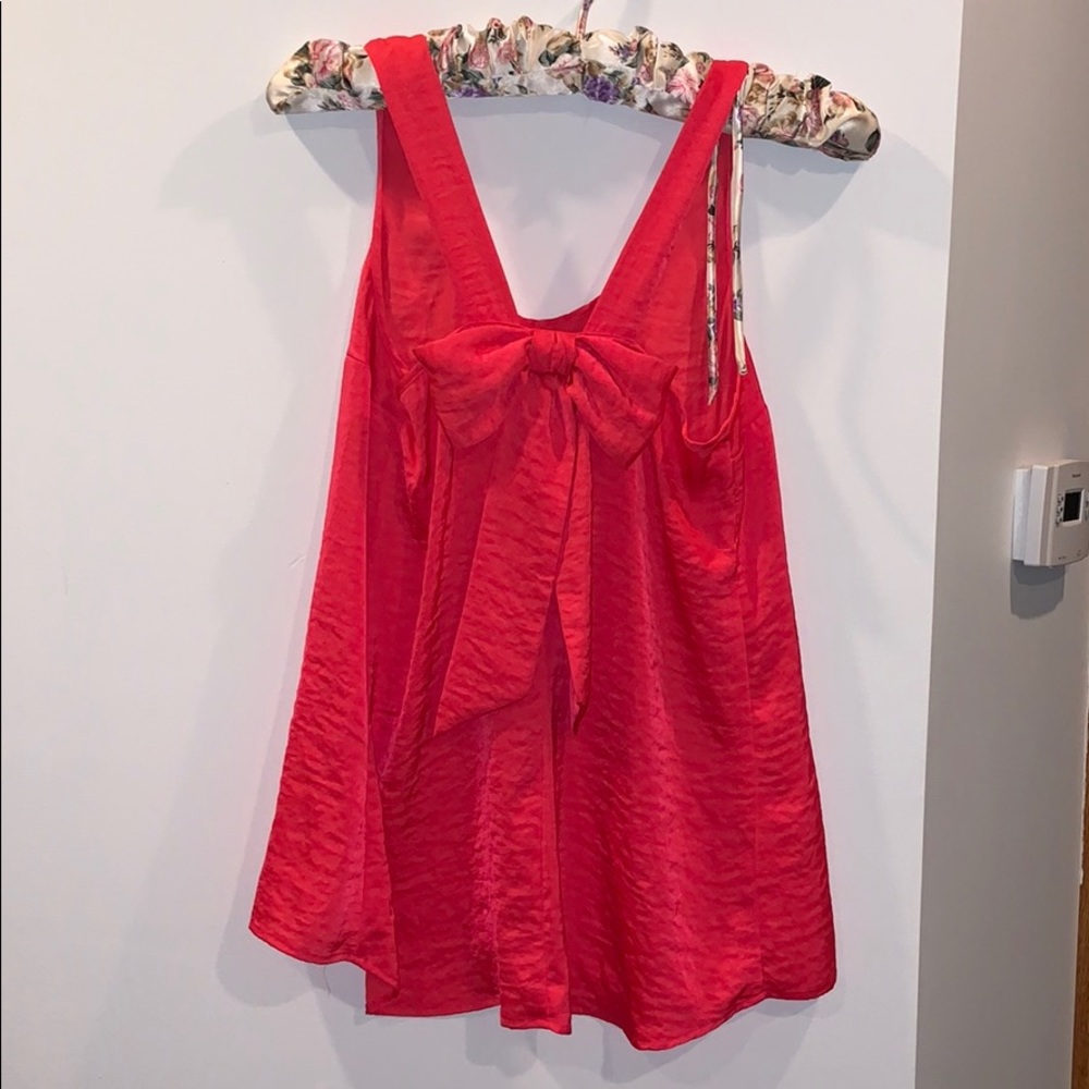 Pink blouse with bow in the back